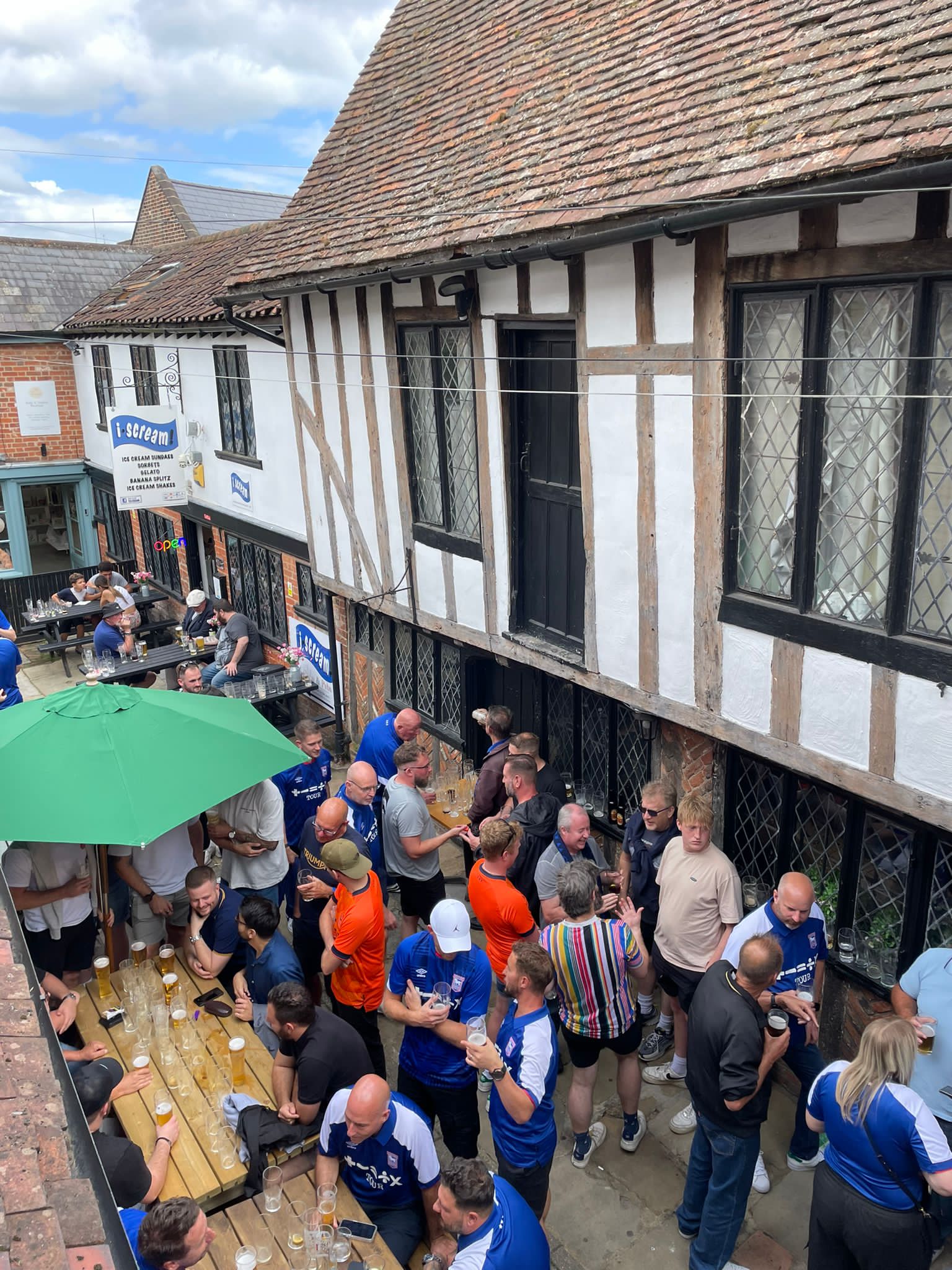 Busy pub courtyard football fans